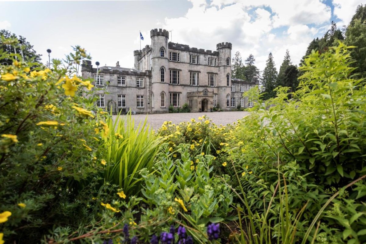 Melville Castle Hotel in Edinburgh framed by flowers