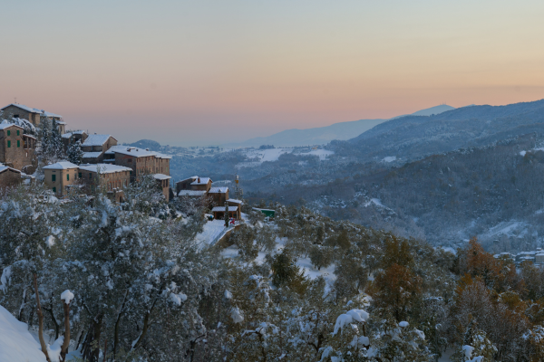 The rolling hills of Tuscany covered in snow